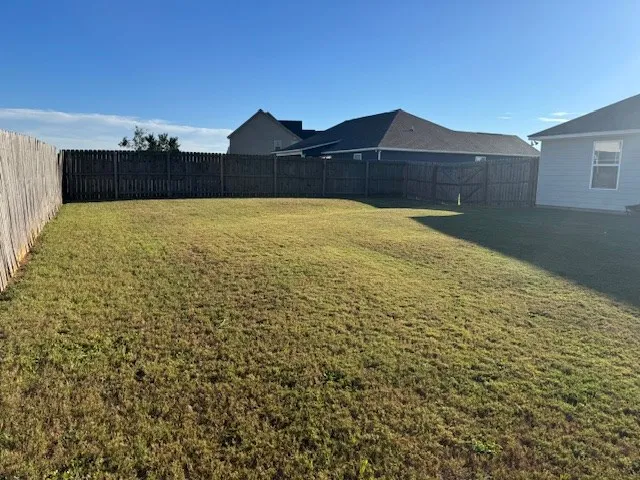 a view of a large house with a yard