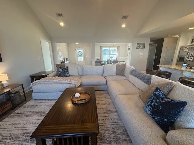 a living room with furniture and a rug