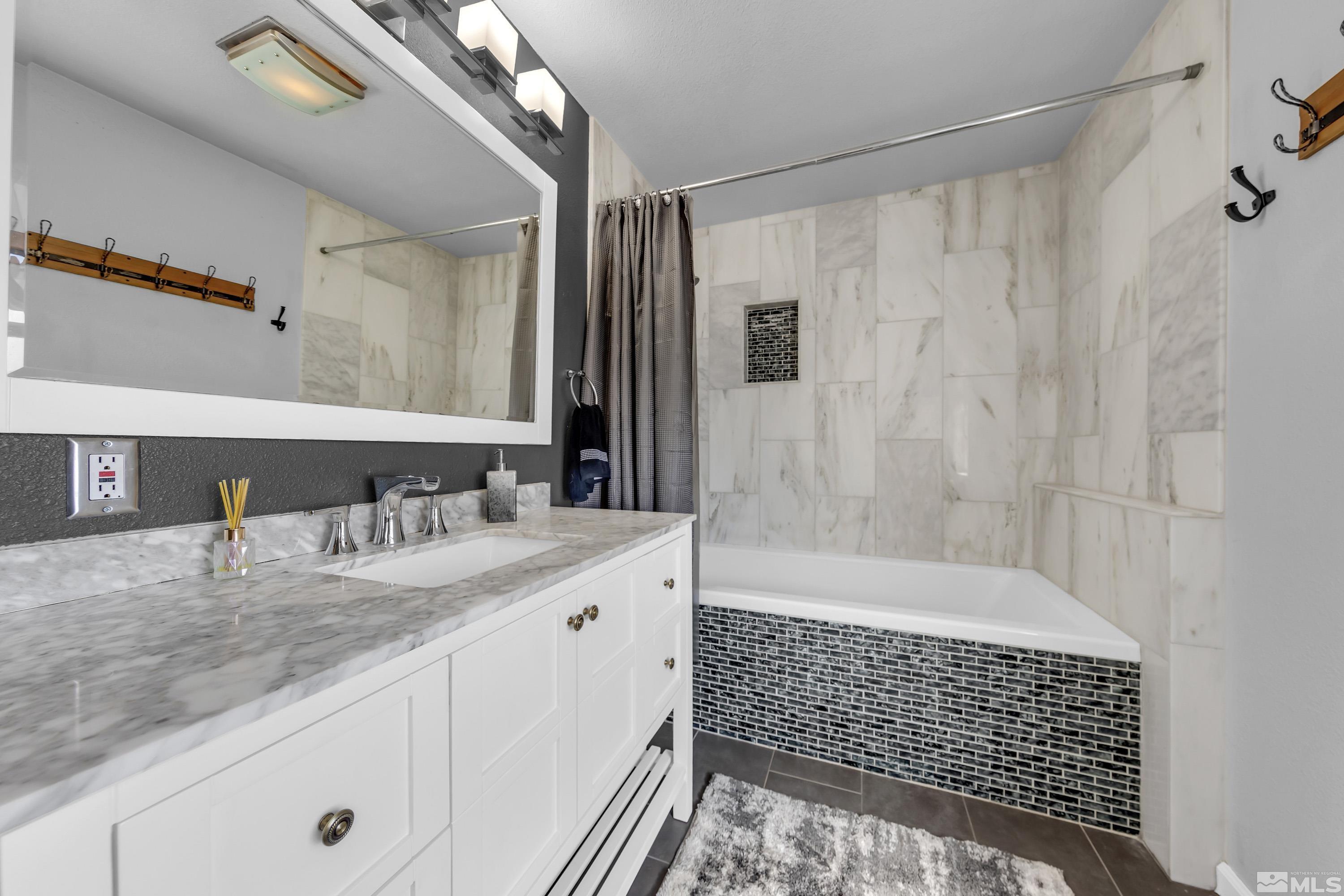 770 Ibis Lane Reno, NV 89503 - Photo 17 of 31 a bathroom with a granite countertop sink a shower and a mirror