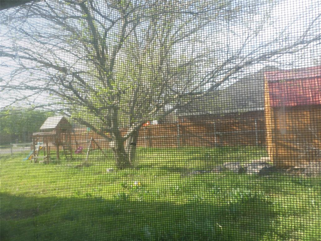 606 West Mulberry Street Decatur, TX 76234 - Photo 20 of 20 View of property exterior featuring a yard and fence