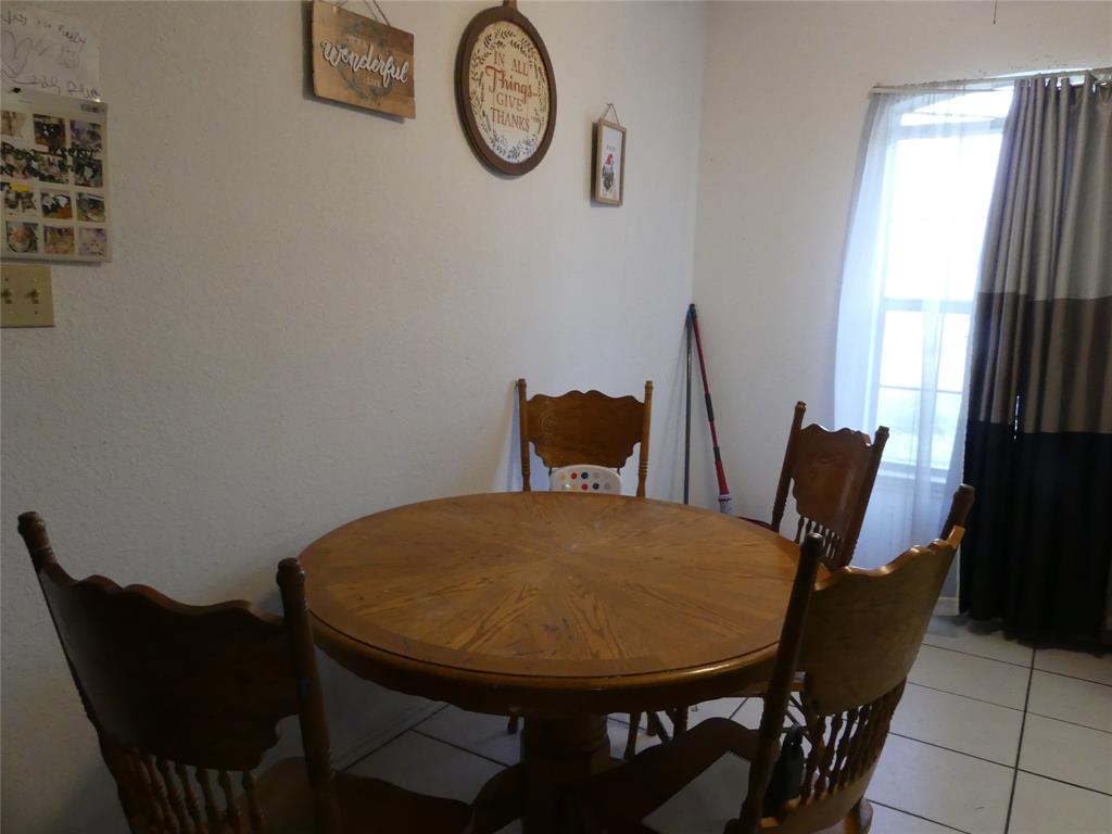 606 West Mulberry Street Decatur, TX 76234 - Photo 10 of 20 Dining area featuring light tile patterned flooring