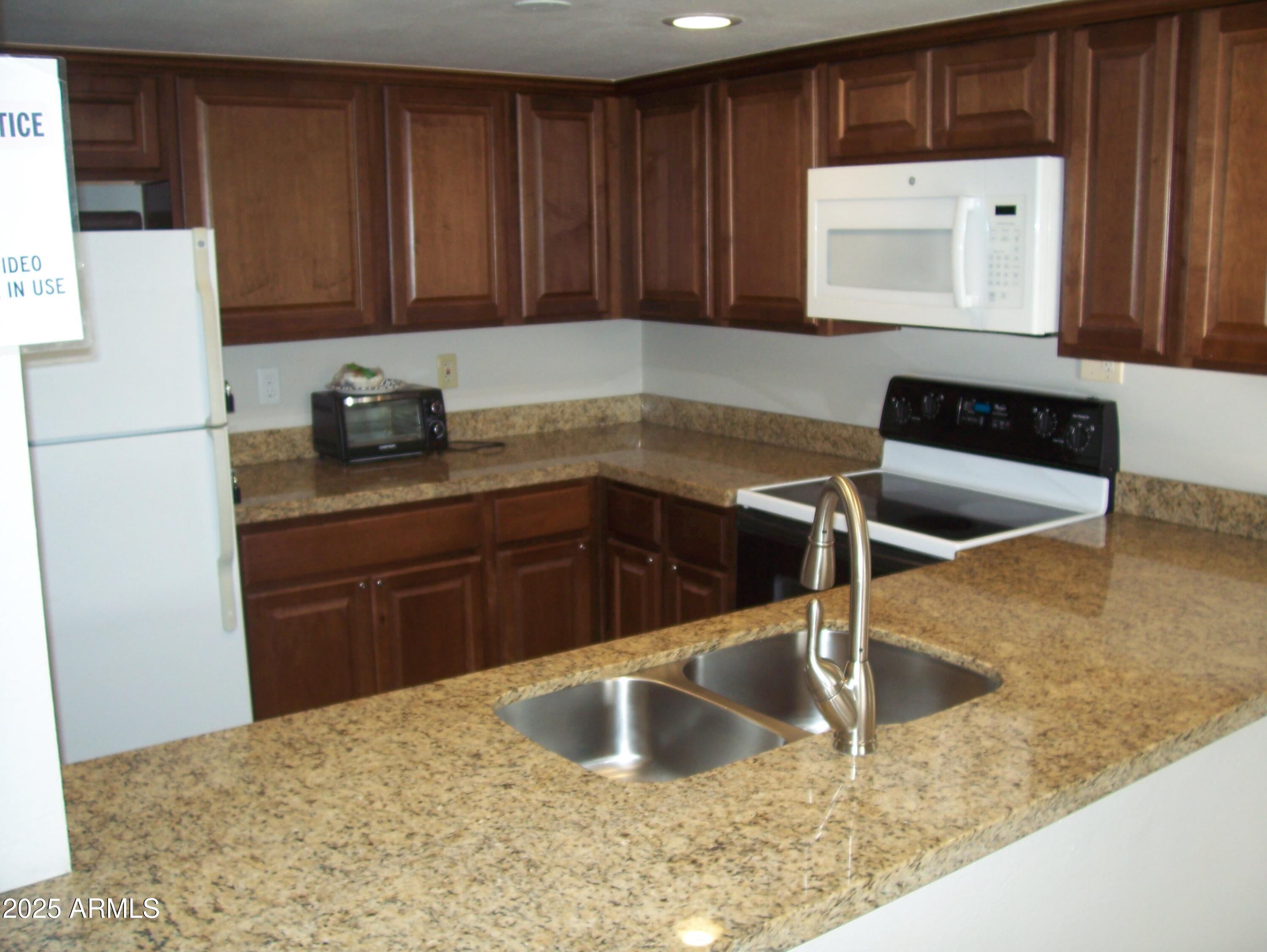 7625 East Camelback Road, Unit A103 Scottsdale, AZ 85251 - Photo 14 of 36 Clubhouse Kitchen