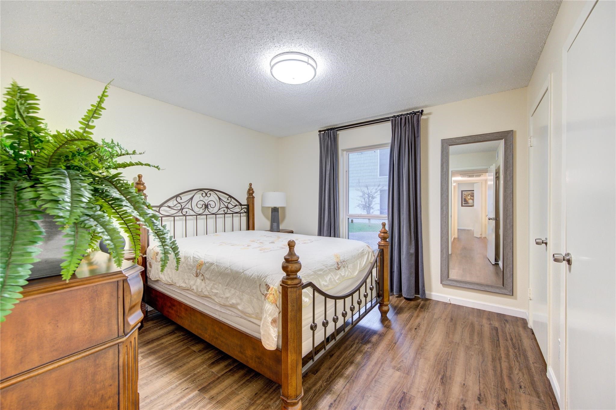 1901 South Voss Road, Unit 4 Houston, TX 77057 - Photo 15 of 26 a bedroom with a bed and a window