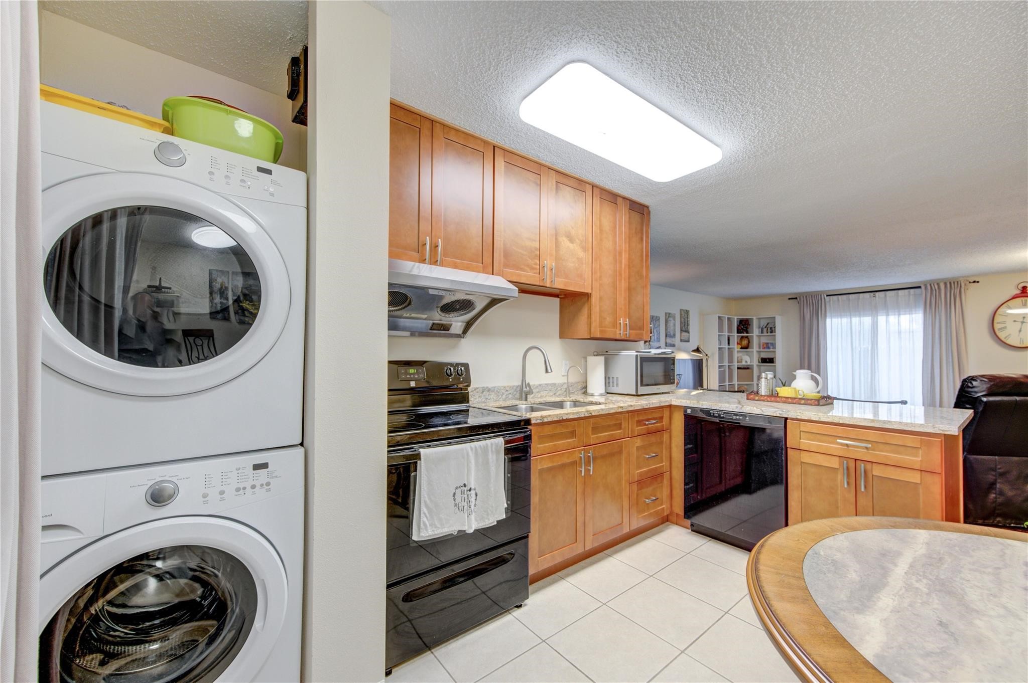 1901 South Voss Road, Unit 4 Houston, TX 77057 - Photo 8 of 26 a kitchen with cabinets and stainless steel appliances