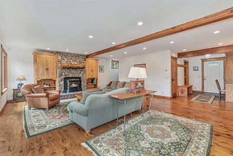 a living room with furniture flat screen tv and a fireplace