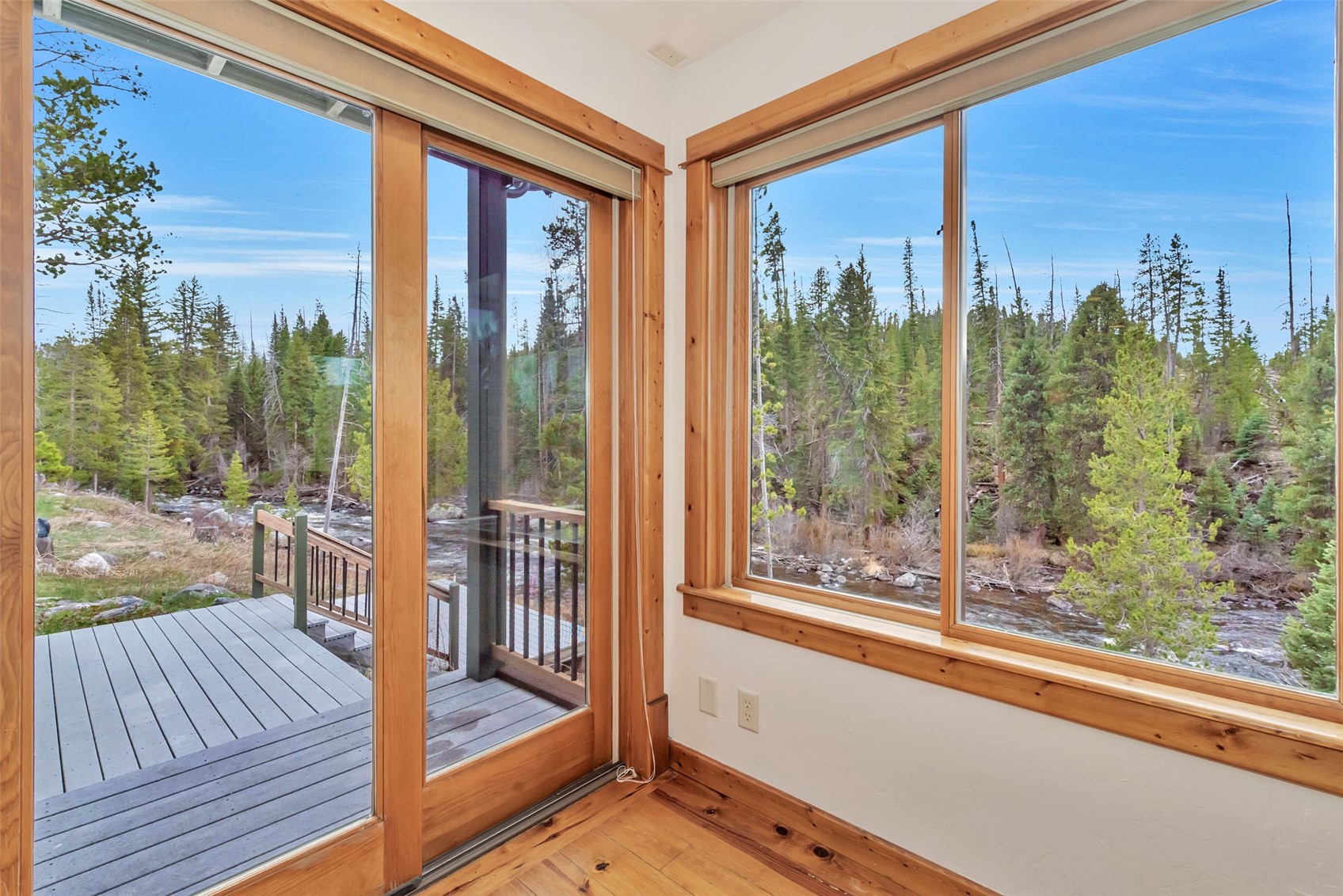 31405 Seedhouse Road Clark, CO 80428 - Photo 14 of 50 a view of a room with a large window and wooden floor