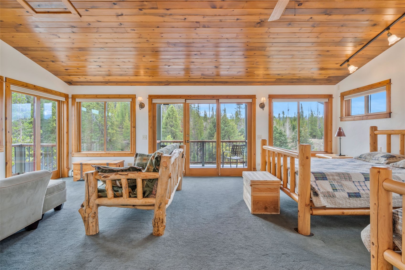 31405 Seedhouse Road Clark, CO 80428 - Photo 27 of 50 a living room with furniture and a floor to ceiling window
