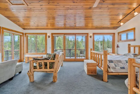 a room that has a window and a wooden floor