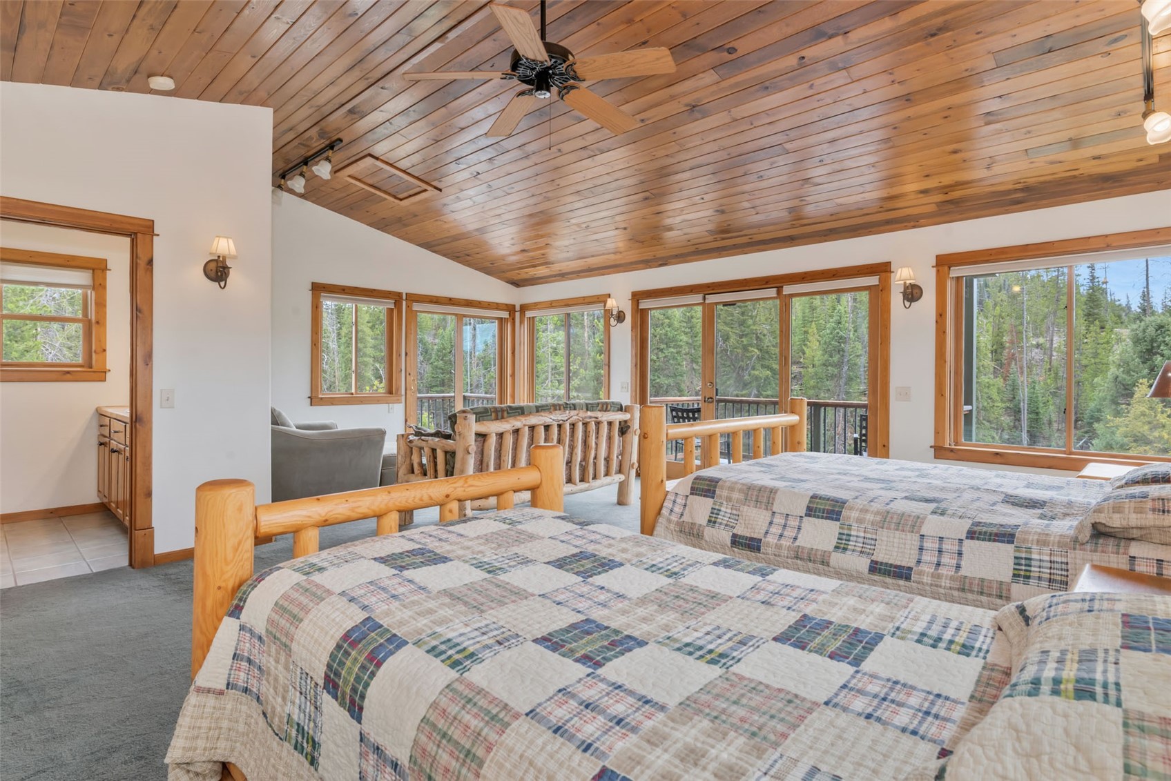 31405 Seedhouse Road Clark, CO 80428 - Photo 29 of 50 a large bedroom with a large bed and large windows