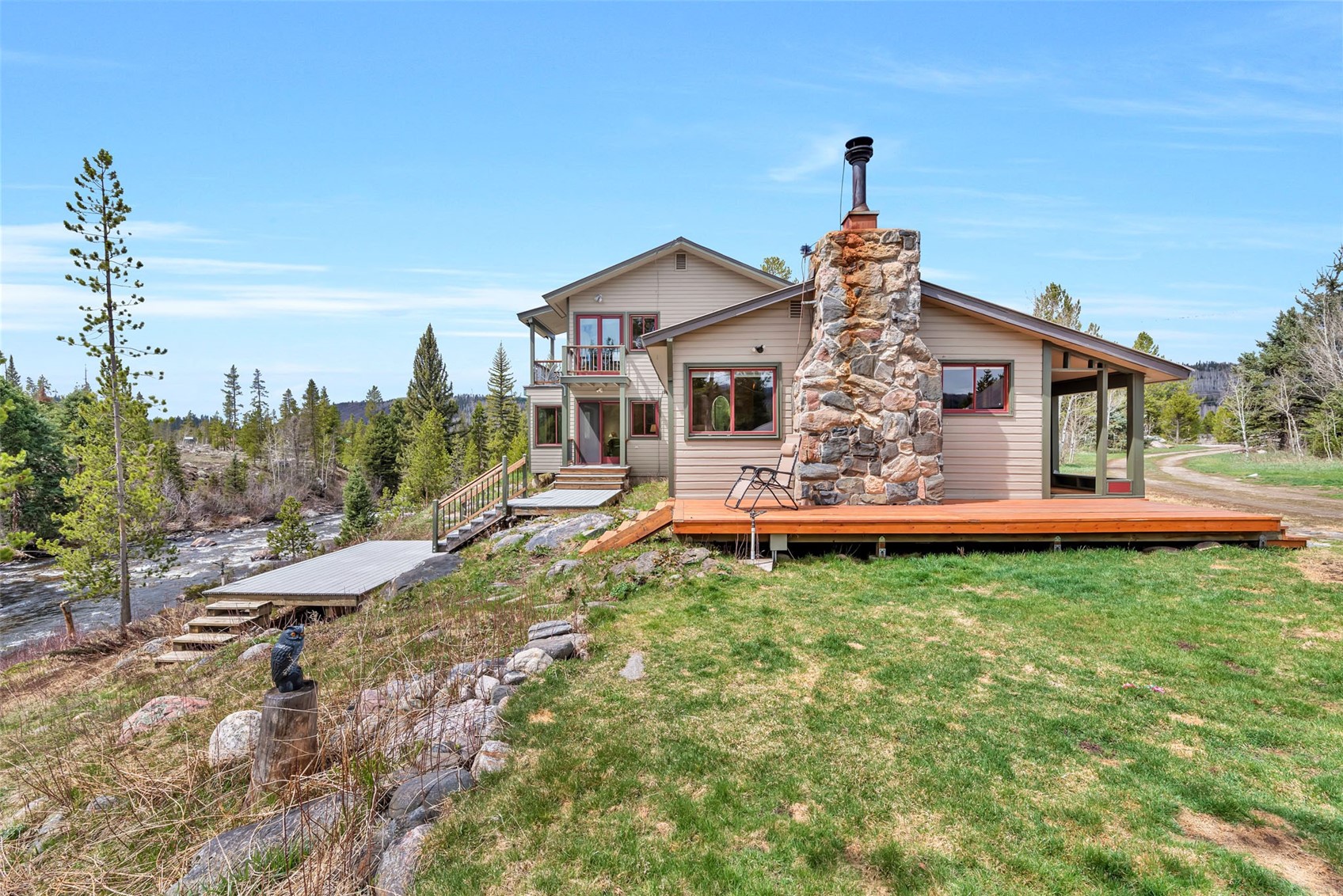 31405 Seedhouse Road Clark, CO 80428 - Photo 3 of 50 a front view of house with yard and trees in the background