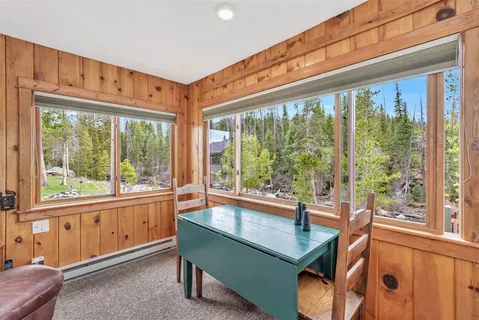 a view of wooden floor and a window