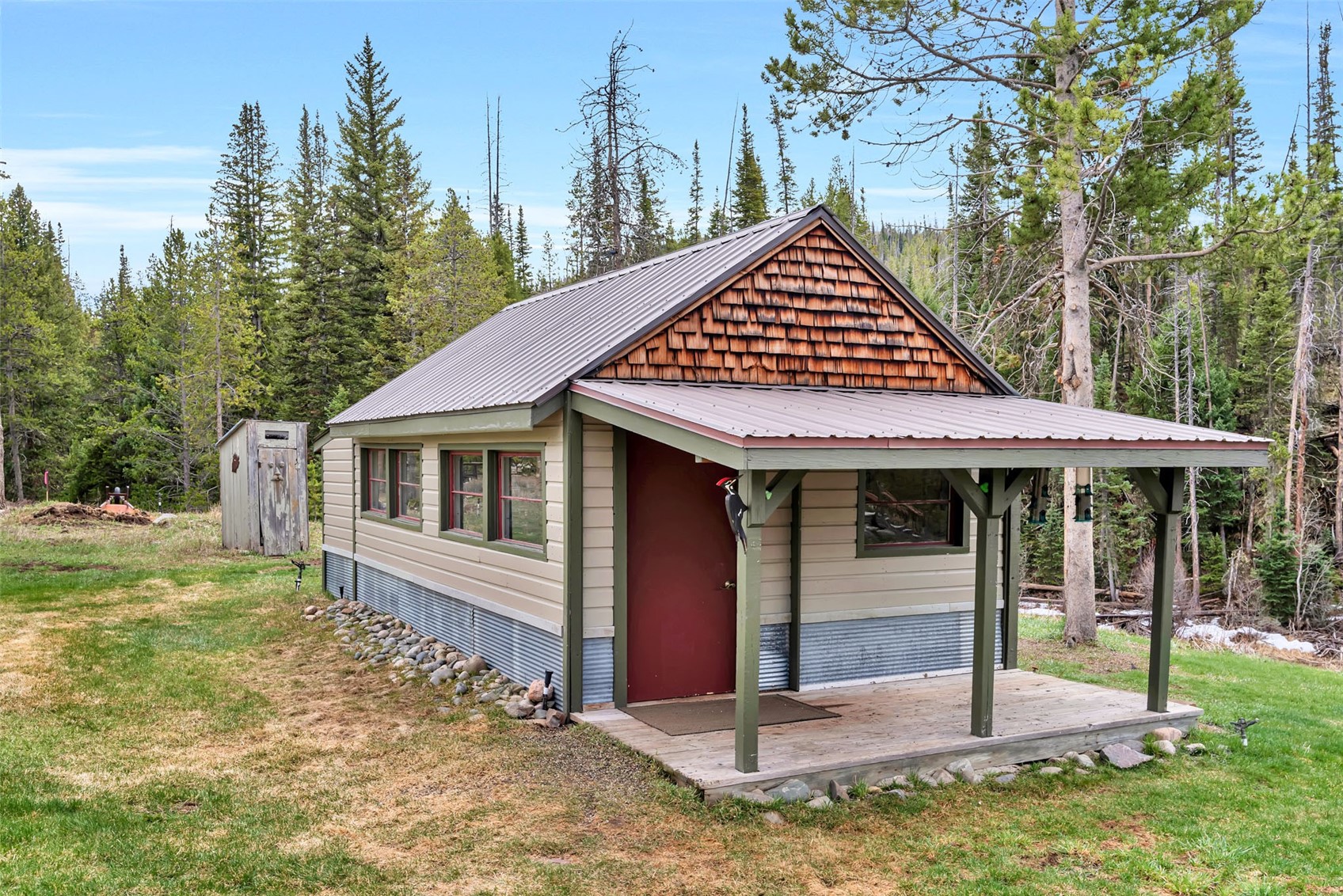 31405 Seedhouse Road Clark, CO 80428 - Photo 46 of 50 a view of a house with backyard porch and sitting area