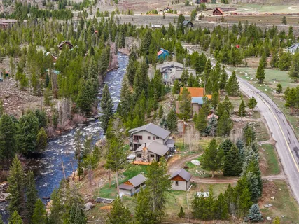 an aerial view of residential houses with outdoor space