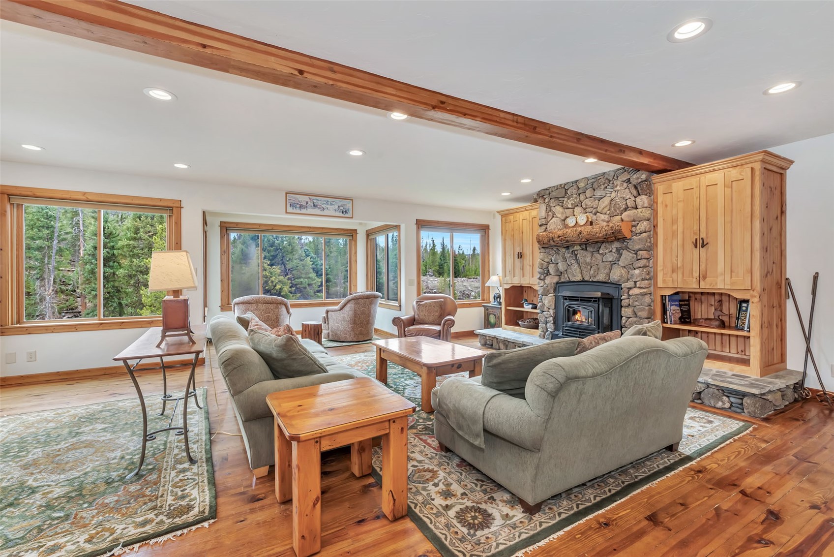 31405 Seedhouse Road Clark, CO 80428 - Photo 10 of 50 a living room with fireplace furniture and a large window