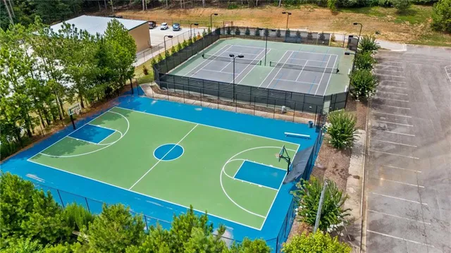 a view of swimming pool with a yard and plants