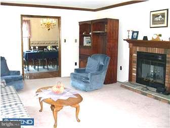 4 Highpoint Road Perkasie, PA 18944 - Photo 7 of 12 a living room with furniture and a fireplace