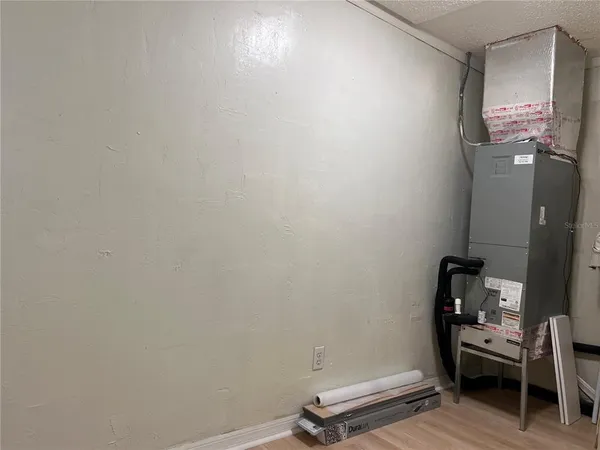 a view of a livingroom with furniture and wooden floor