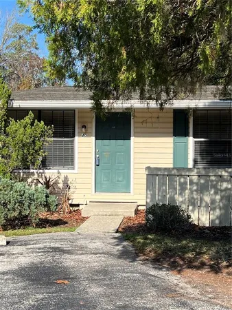 a view of a house with a yard and garage