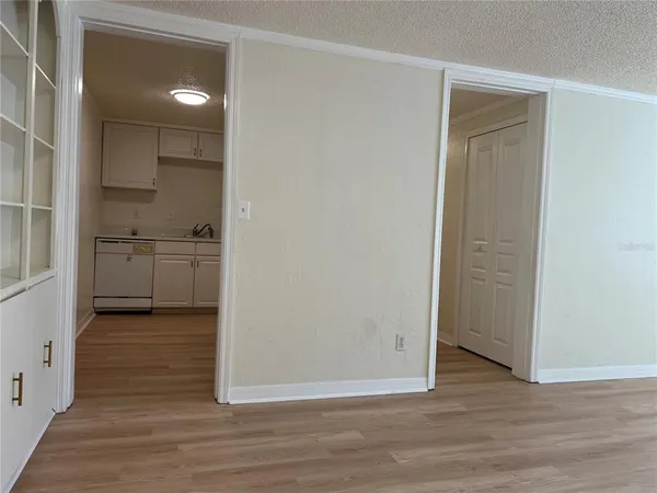 a kitchen with stainless steel appliances white cabinets and a sink