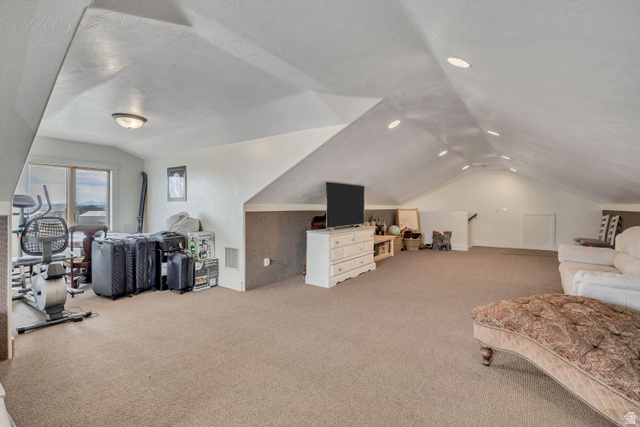 3054 West Ridgeline Road Stockton, UT 84071 - Photo 45 of 88 Additional living space featuring light colored carpet and a textured ceiling