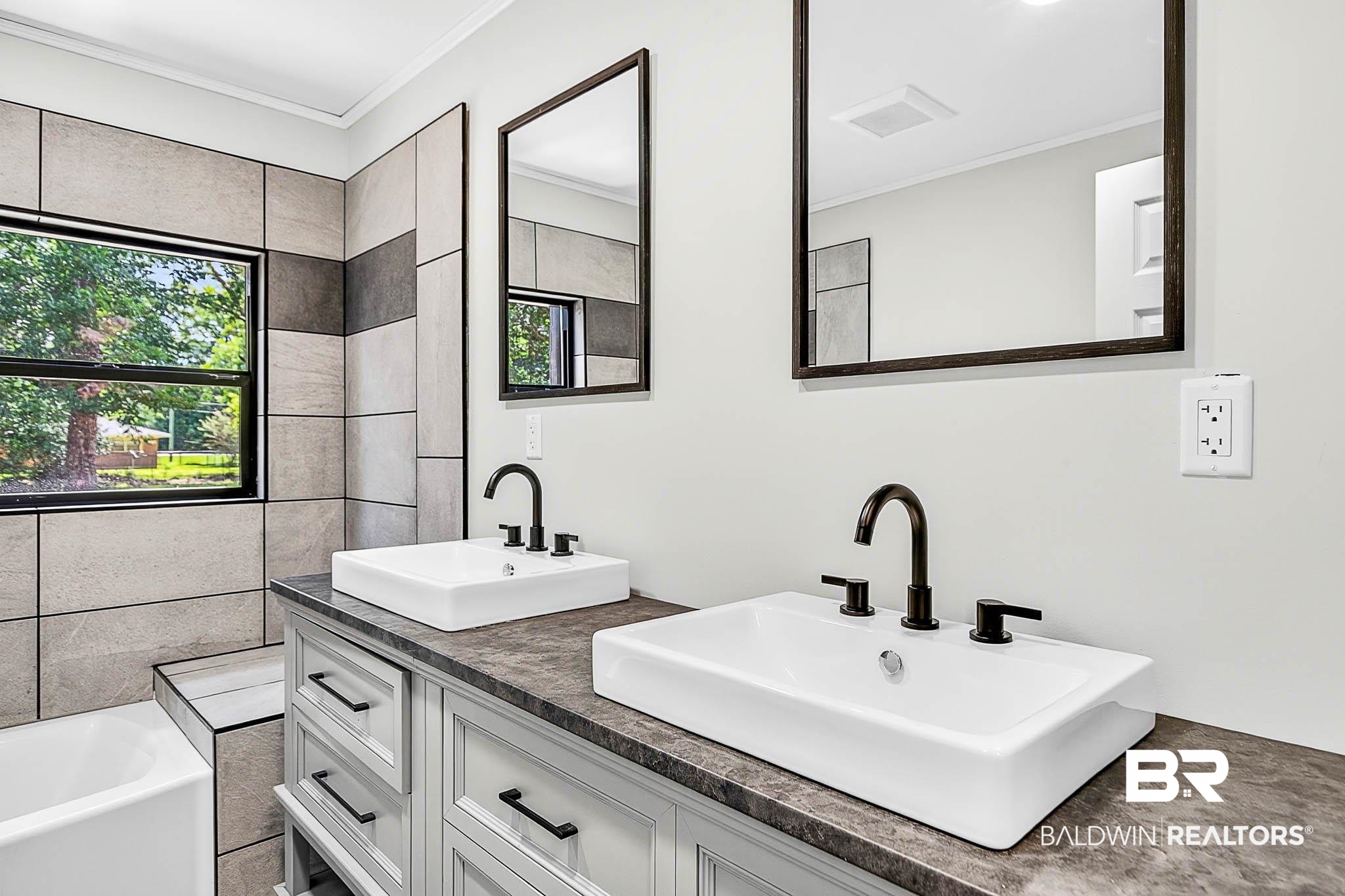 101 Terry Avenue Brewton, AL 36426 - Photo 44 of 48 Bathroom featuring healthy amount of natural light, crown molding, double vanity, and a tub to relax in