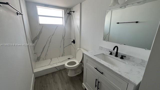1780 Northeast 191st Street, Unit 8112 Miami, FL 33179 - Photo 12 of 24 a bathroom with a sink a toilet and shower