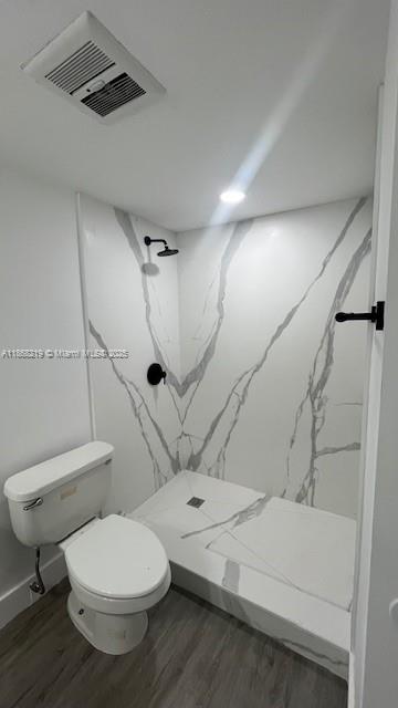 1780 Northeast 191st Street, Unit 8112 Miami, FL 33179 - Photo 13 of 24 a bathroom with a toilet sink and shower
