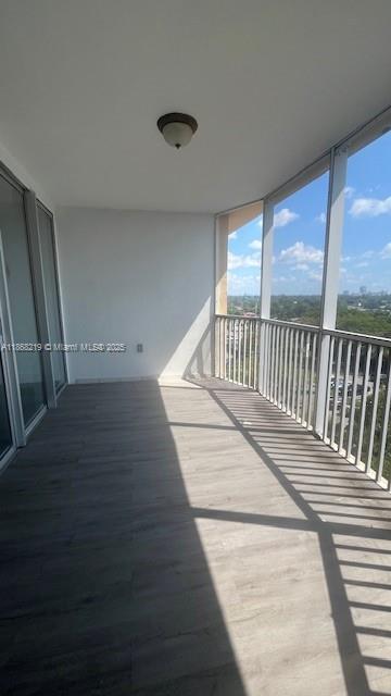 1780 Northeast 191st Street, Unit 8112 Miami, FL 33179 - Photo 18 of 24 a view of balcony with wooden floor