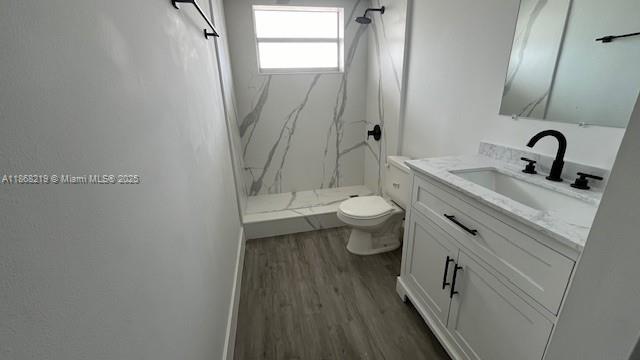 1780 Northeast 191st Street, Unit 8112 Miami, FL 33179 - Photo 10 of 24 a bathroom with a toilet sink and mirror