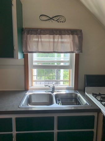 27 Fulton Street Fall River, MA 02720 - Photo 11 of 41 a kitchen with a sink and large window