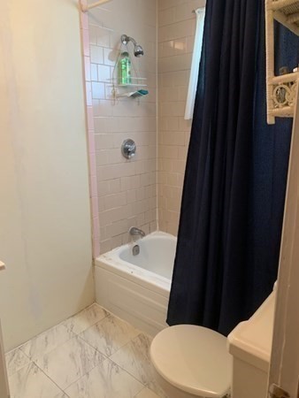 27 Fulton Street Fall River, MA 02720 - Photo 14 of 41 a bathroom with a toilet a sink and bathtub