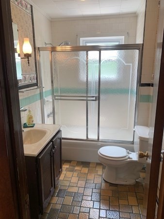 27 Fulton Street Fall River, MA 02720 - Photo 22 of 41 a bathroom with a sink toilet and shower