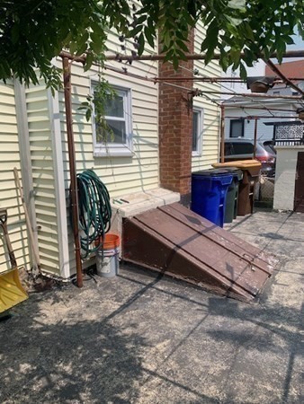 27 Fulton Street Fall River, MA 02720 - Photo 34 of 41 a wooden bench sitting in front of a house