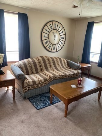 27 Fulton Street Fall River, MA 02720 - Photo 5 of 41 a living room with furniture and window