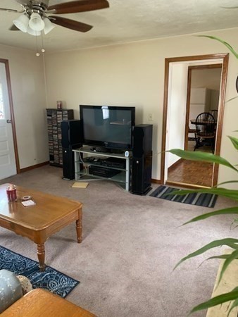 27 Fulton Street Fall River, MA 02720 - Photo 6 of 41 a living room with furniture and a flat screen tv