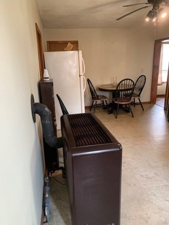 27 Fulton Street Fall River, MA 02720 - Photo 9 of 41 a living room with furniture and a chair