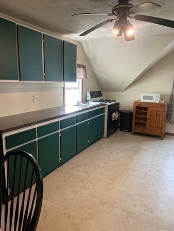 27 Fulton Street Fall River, MA 02720 - Photo 10 of 41 a kitchen with lots of counter space and cabinets