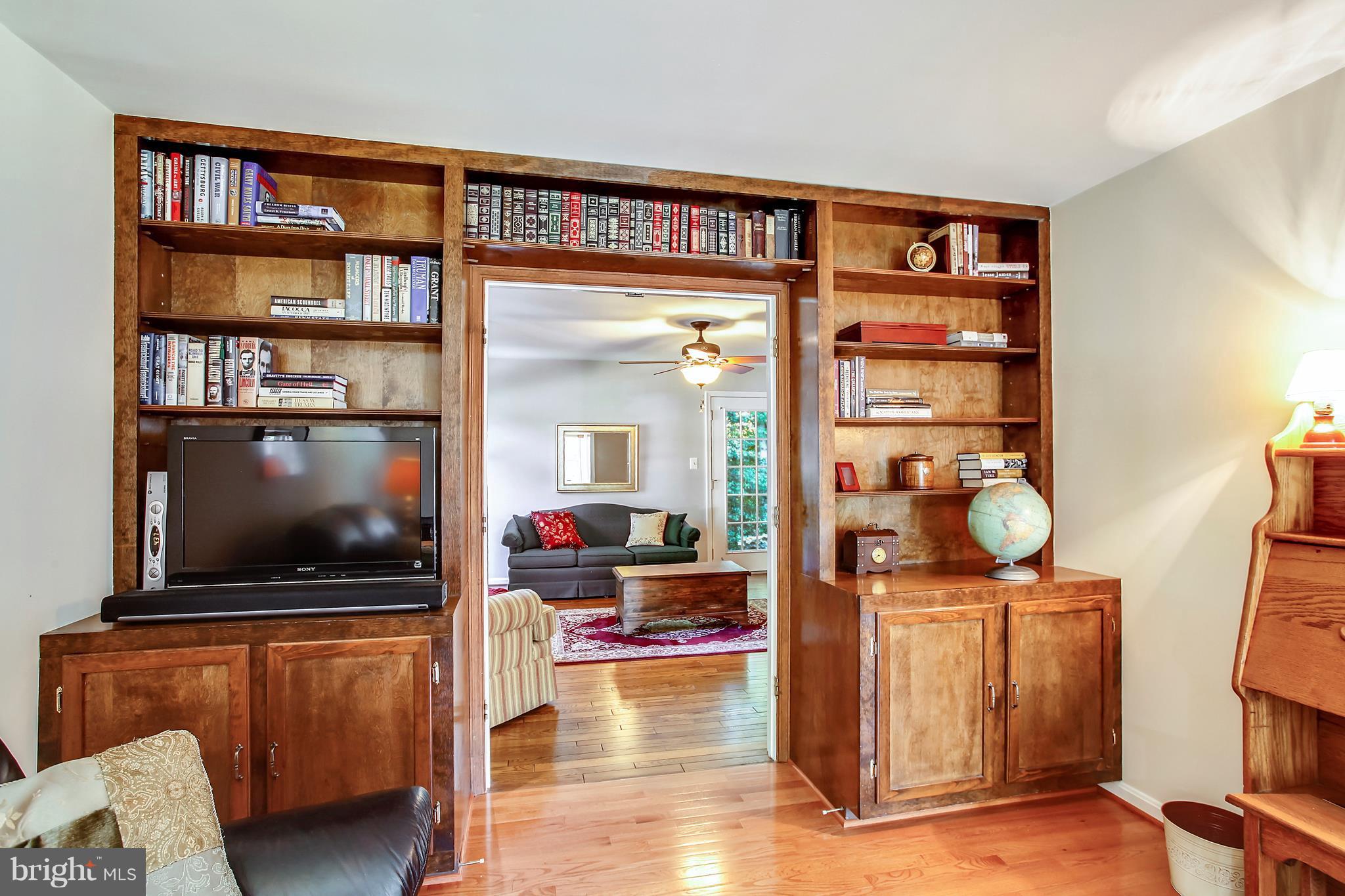 11887 Fawn Ridge Lane Reston, VA 20194 - Photo 12 of 27 Wall of book shelves