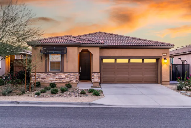 a front view of a house with a garage