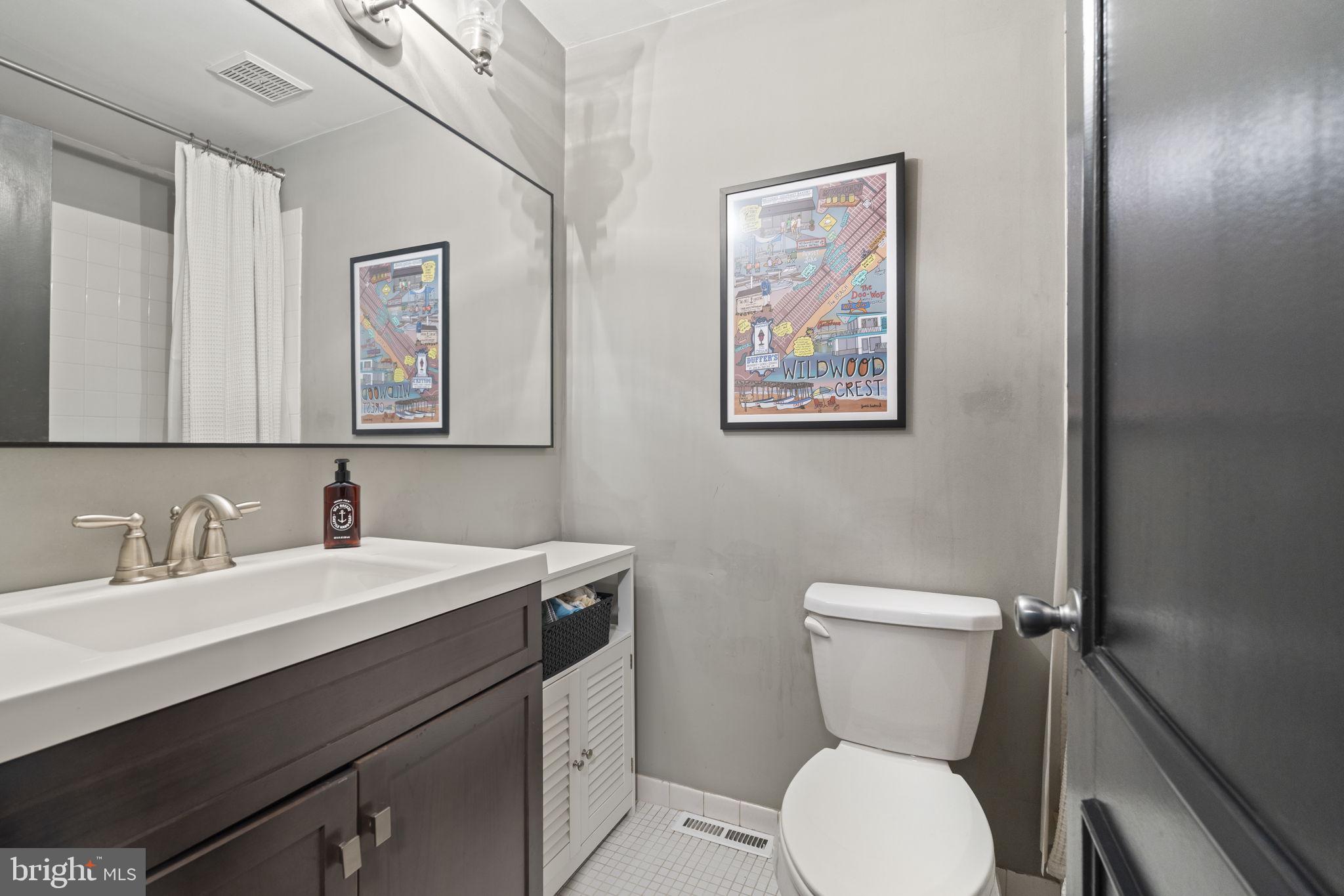 3508 San Rafael Court Springfield, PA 19064 - Photo 17 of 22 a bathroom with a toilet sink and mirror