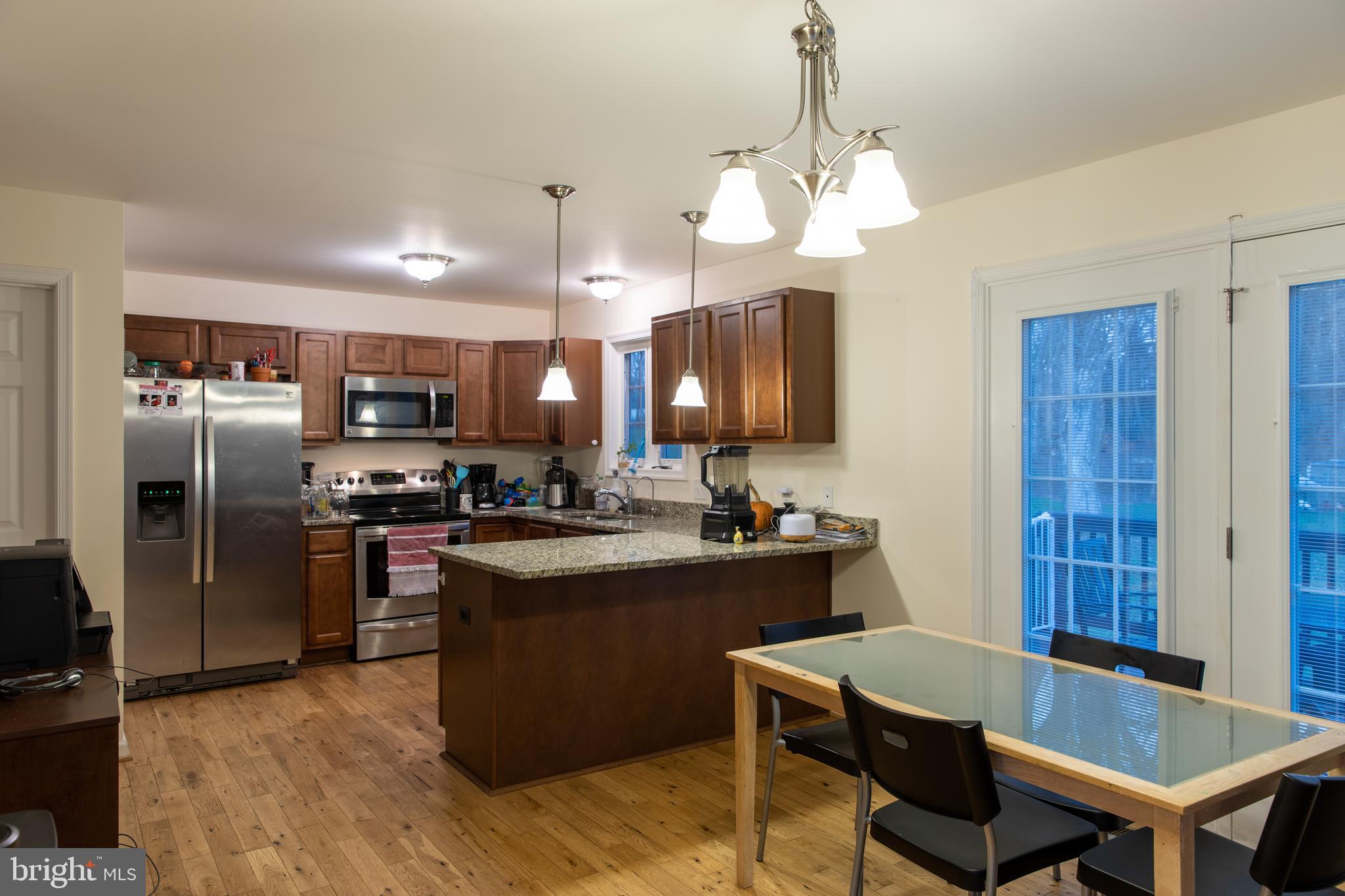 19719 Old Orange Road Culpeper, VA 22701 - Photo 11 of 43 kitchen/dining area leading to deck