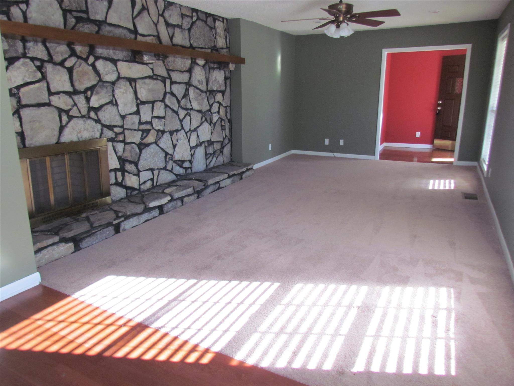 2680 Old Murfreesboro Road West Lebanon, TN 37090 - Photo 2 of 30 Inside the inviting covered front porch is the formal living room which features a gorgeous floor to ceiling rock fireplace