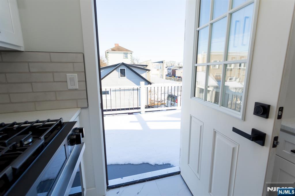 17 Warren Street, Unit 2 Bergenfield, NJ 07621 - Photo 11 of 28 a kitchen with a stove and a window