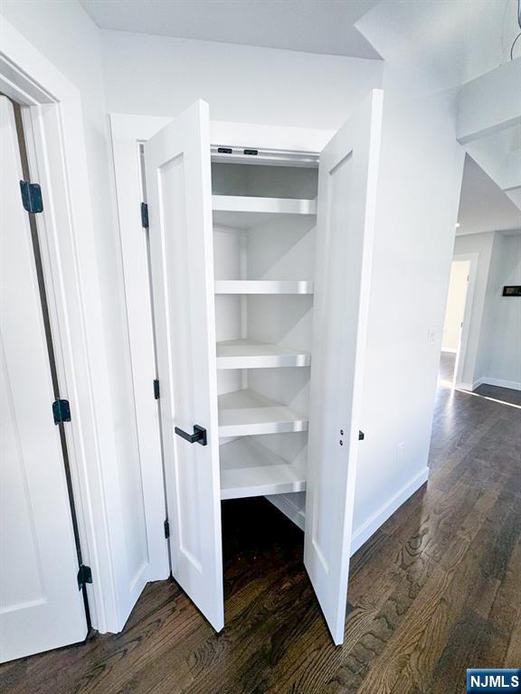 17 Warren Street, Unit 2 Bergenfield, NJ 07621 - Photo 12 of 28 a view of a hallway with wooden floor and staircase