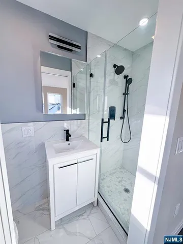 a bathroom with a sink a toilet and mirror