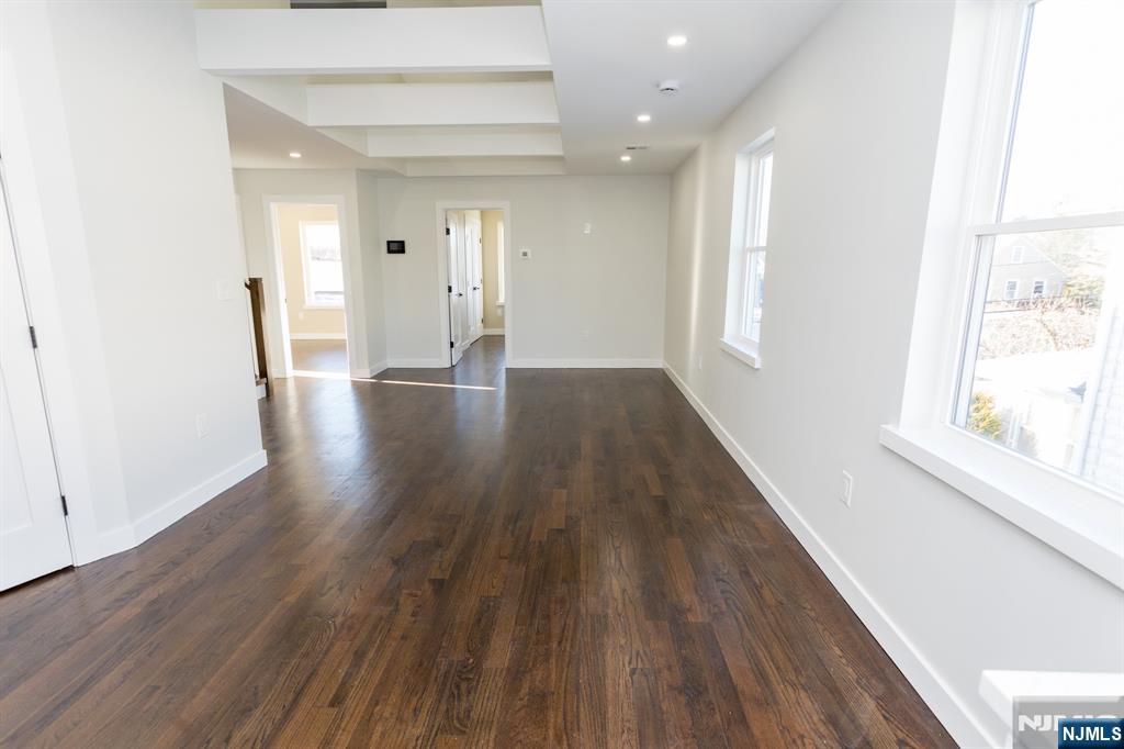 17 Warren Street, Unit 2 Bergenfield, NJ 07621 - Photo 2 of 28 a view of an empty room with wooden floor and a window