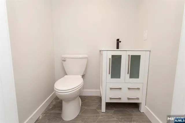 a bathroom with a toilet and a sink