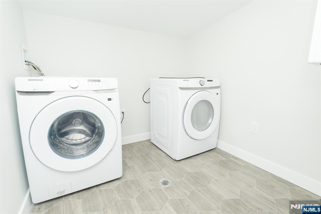 17 Warren Street, Unit 2 Bergenfield, NJ 07621 - Photo 27 of 28 a utility room with dryer and washer