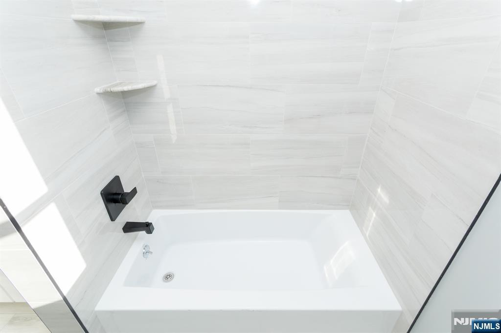 17 Warren Street, Unit 2 Bergenfield, NJ 07621 - Photo 28 of 28 a bathroom with a bathtub