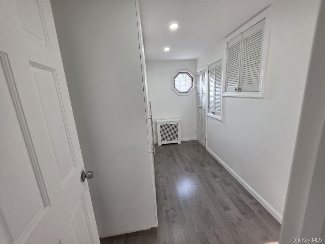 30 Aberdeen Road New Hyde Park, NY 11040 - Photo 11 of 37 an empty room with wooden floor and windows